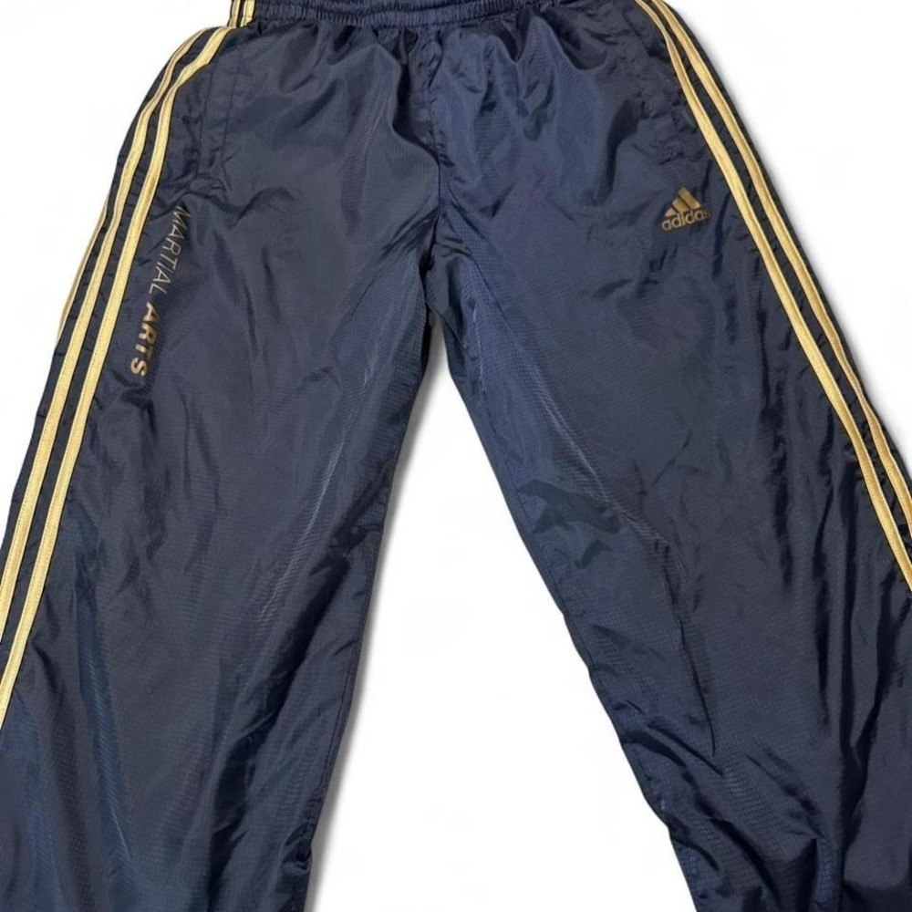 Adidas Martial Arts track pants in navy blue with gold 3-stripe detail and gold